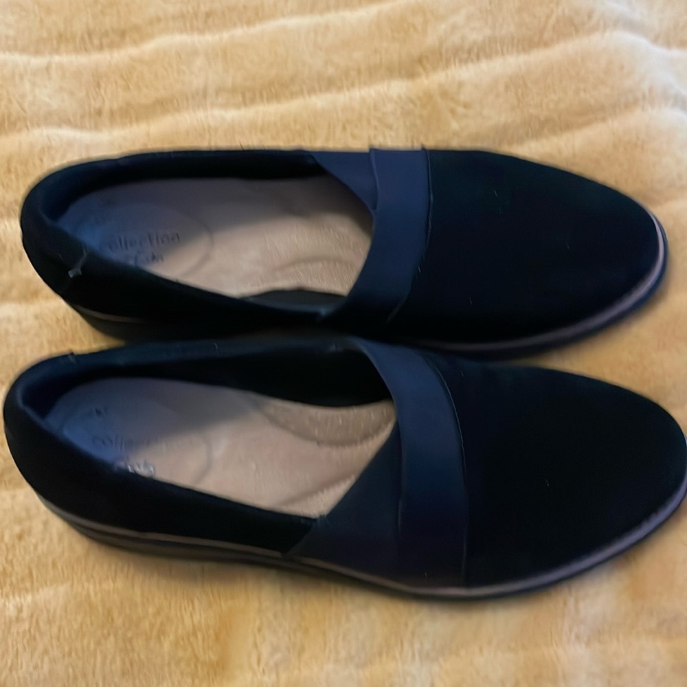 Black suede slip on shoe.